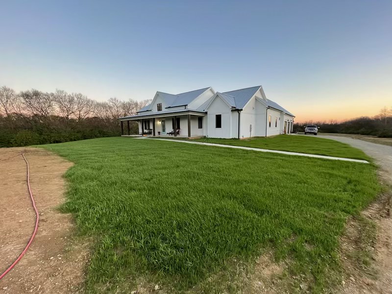 Residential yard after professional hydroseeding in Cincinnati with lush green lawn